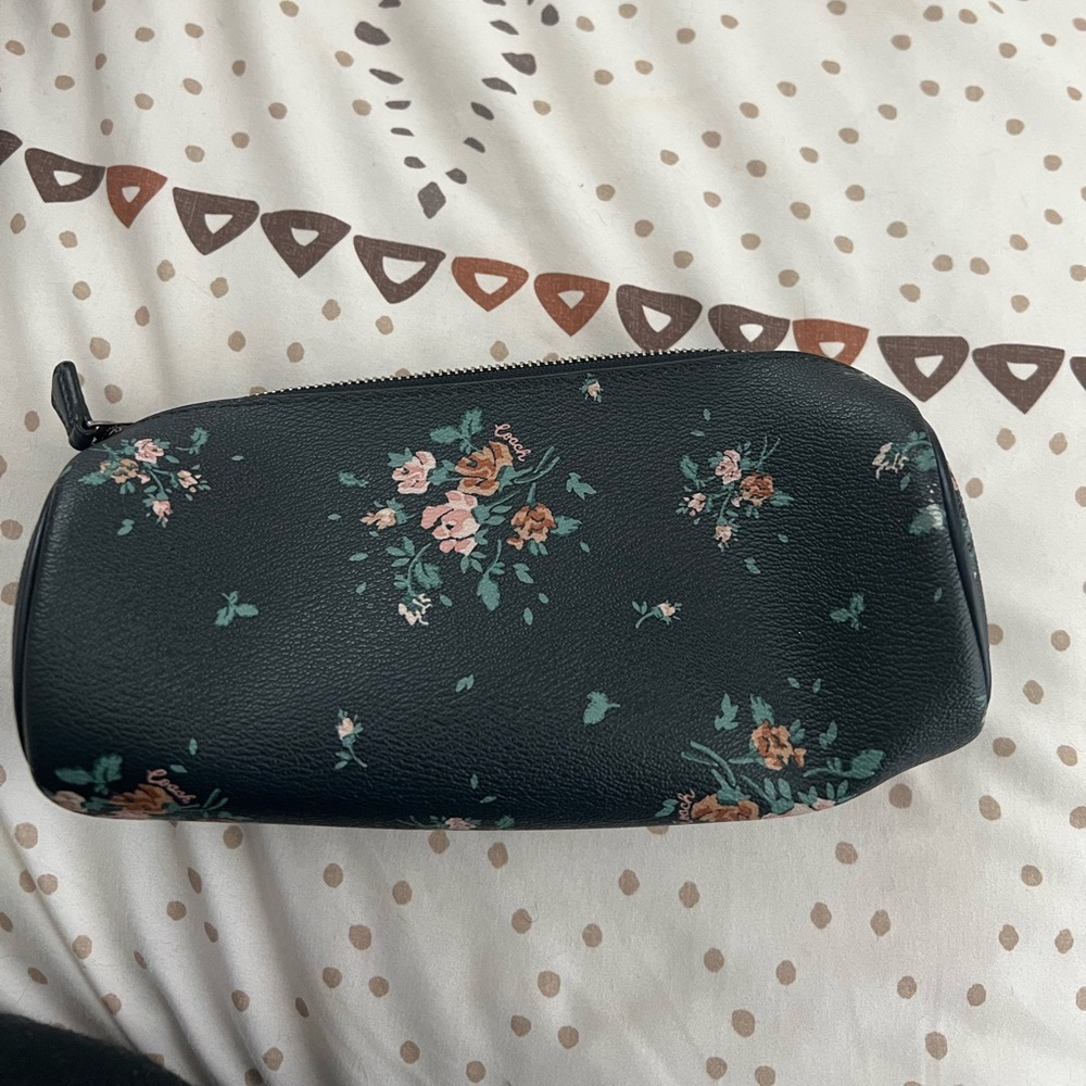 Navy blue floral coach cosmetic case -